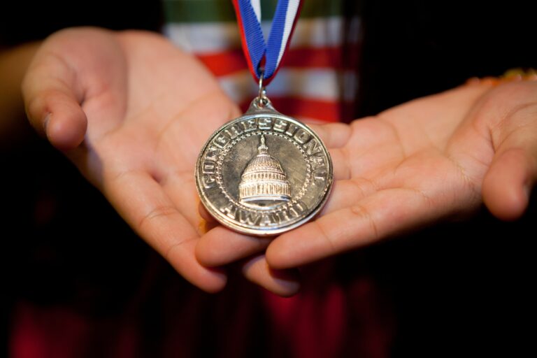 medal in hand